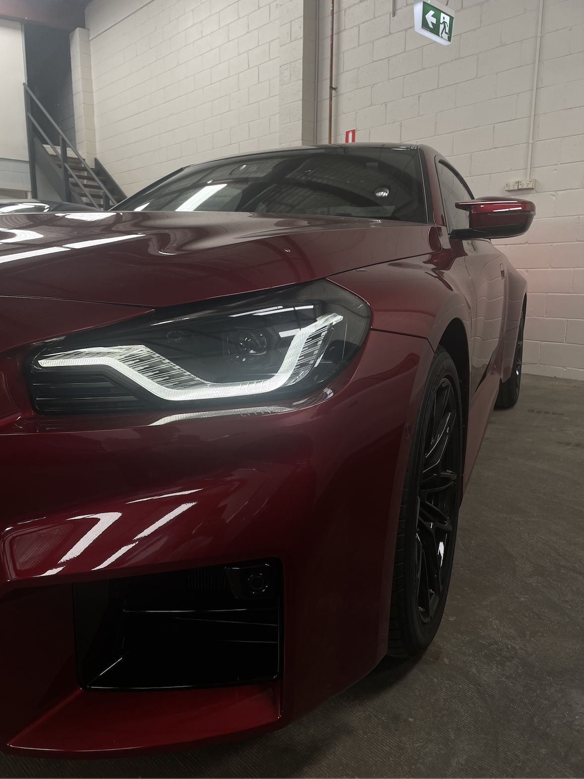 Red BMW M2 front after detailing